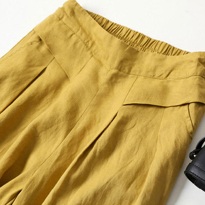 Stylish women's high-waisted wide-leg pants for comfortable modern workwear.