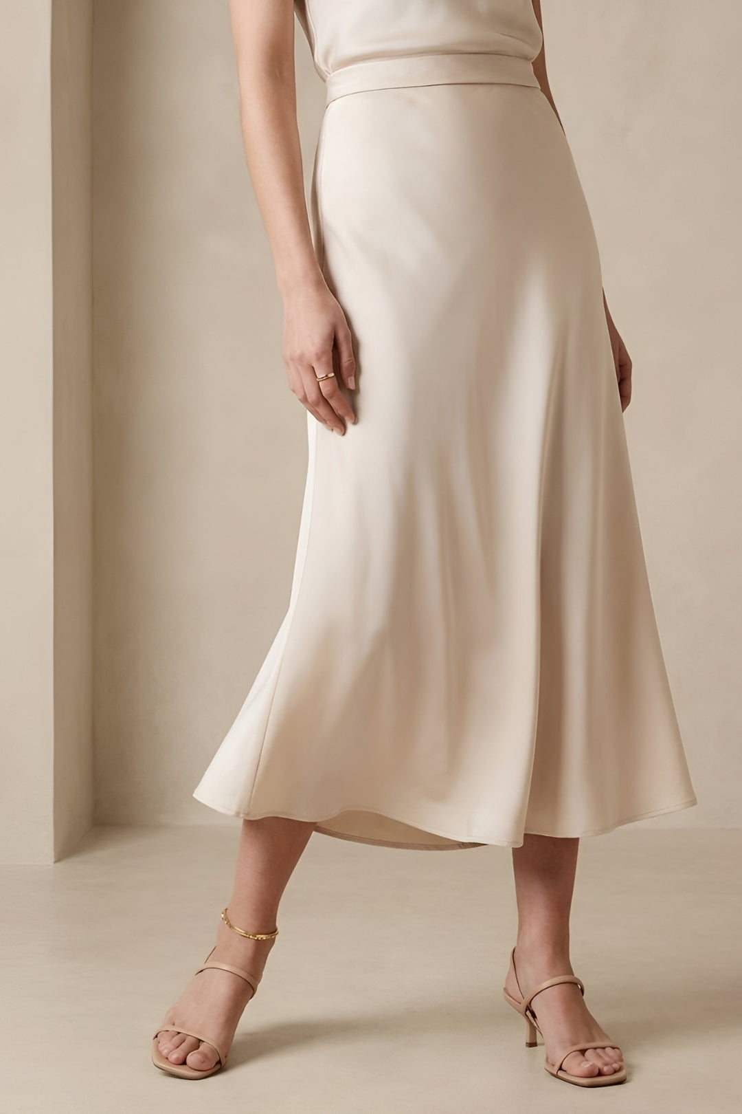 Stylish women's high-waisted A-line midi skirt, great for spring, summer, office, or casual.