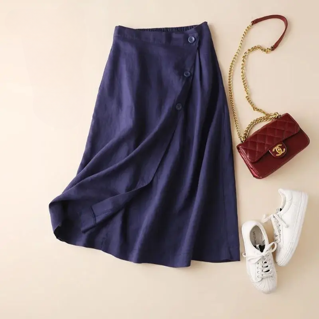 Women's high-waisted A-line midi skirt with stylish side buttons. Elegant for office or casual wear.