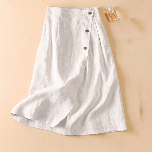 Fashionable women's high-waisted A-line midi skirt. Designed with decorative side buttons. Ideal for spring styles.