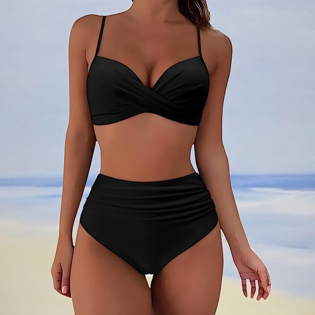Supportive high-waisted bikini for women, featuring a chic twist front design, ideal for comfortable swimming.