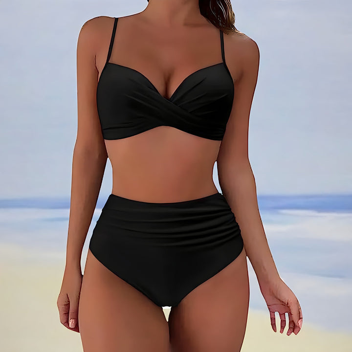 Supportive high-waisted bikini for women, featuring a chic twist front design, ideal for comfortable swimming.