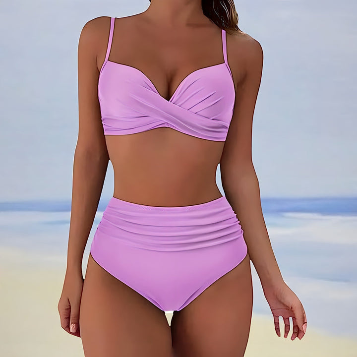 Fashionable high-waisted women's swimwear with a supportive twist front top, offering a flattering silhouette.
