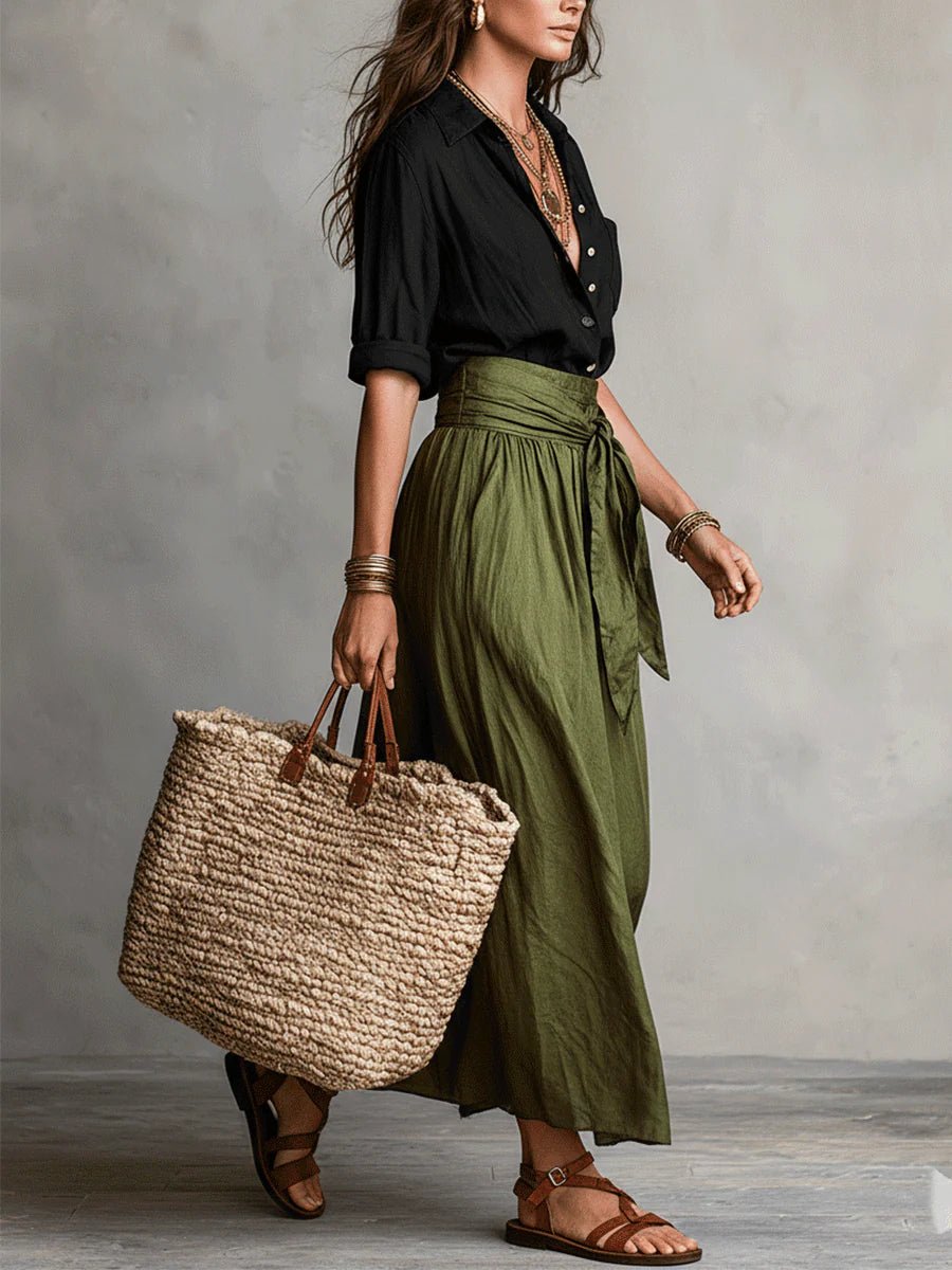 Elegant women's coordinated two-piece set with a button-up top & high-waisted maxi skirt. Versatile casual chic.