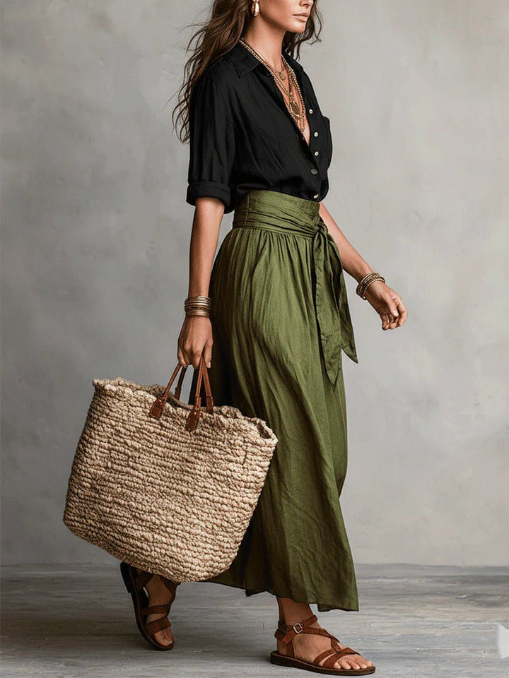 Elegant women's coordinated two-piece set with a button-up top & high-waisted maxi skirt. Versatile casual chic.