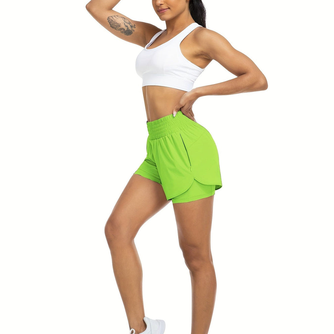 Athletic women's double-layer running shorts, high-waisted for support & freedom during intense training.