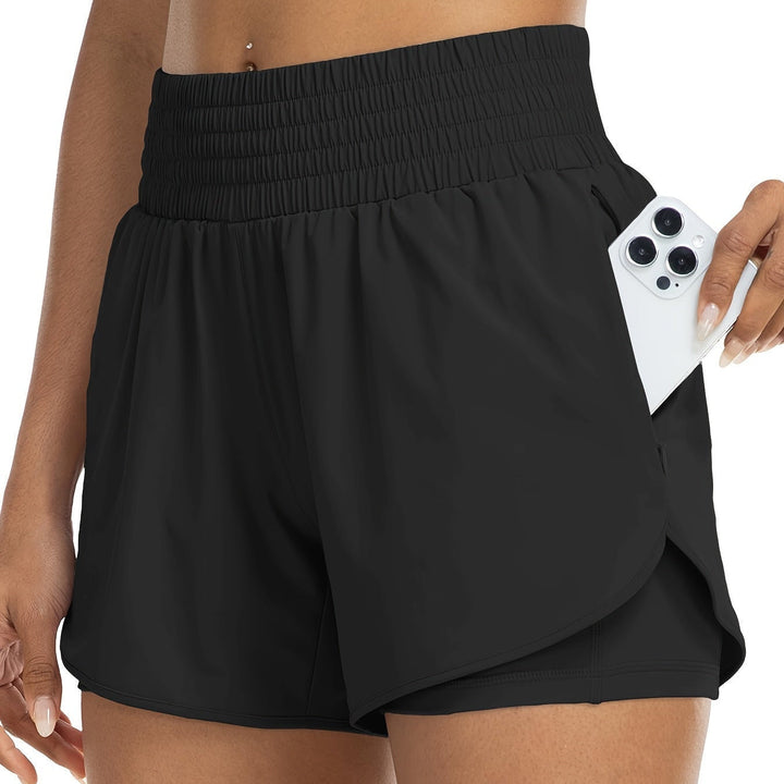 Practical women's double-layer training shorts, high-waisted fit for running, yoga & various gym activities.
