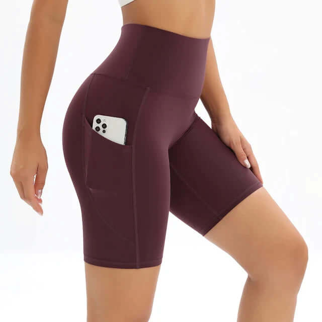 Women's high-waisted fitness shorts with a side pocket, perfect for workouts, gym, and active lifestyles.