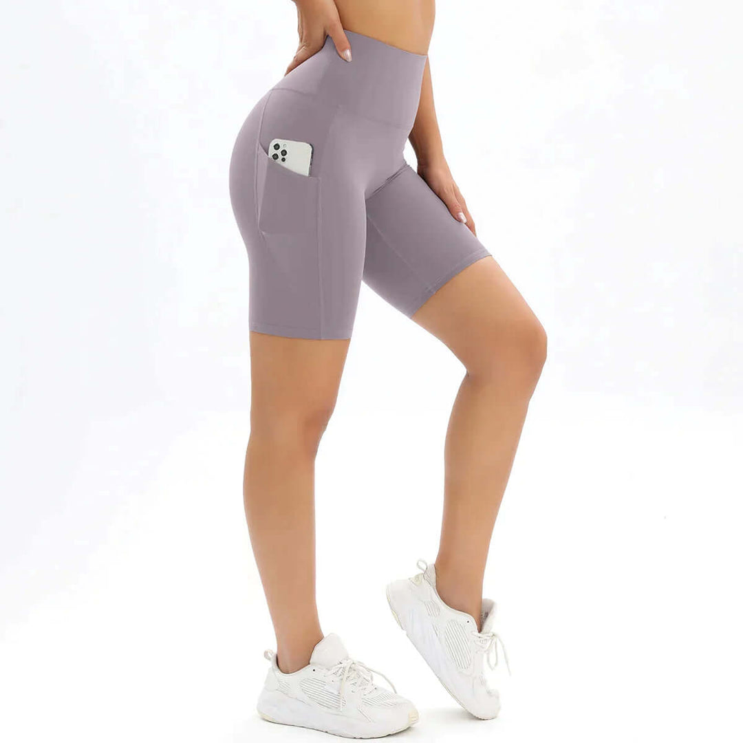 Supportive women's gym shorts, high-waisted with a practical pocket, ideal for diverse fitness routines and active living.