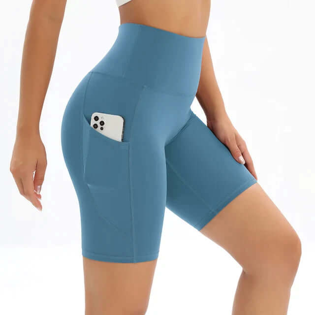 Black high-waisted workout shorts for women, featuring a practical pocket for phone storage during gym or running.