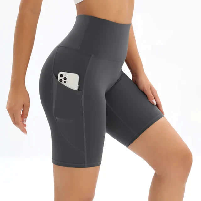 Women's high-waisted athletic shorts, perfect for gym sessions, yoga classes, or outdoor running, with a handy pocket.