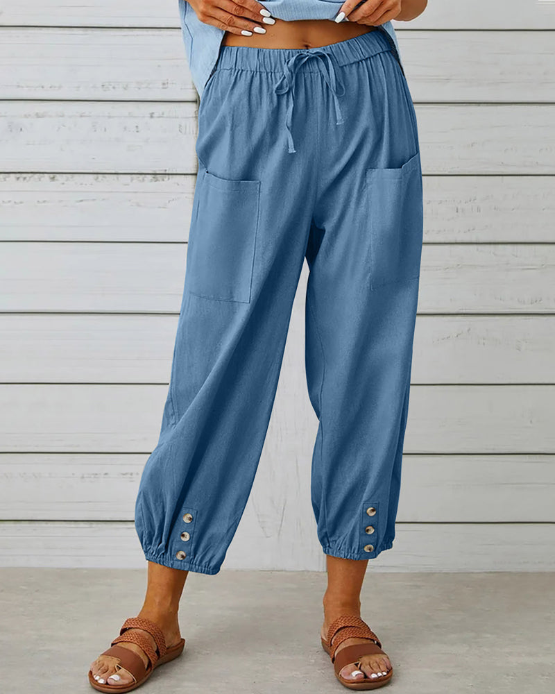 Flat lay of comfortable women's high-waisted loose fit casual pants, highlighting versatile, relaxed design.
