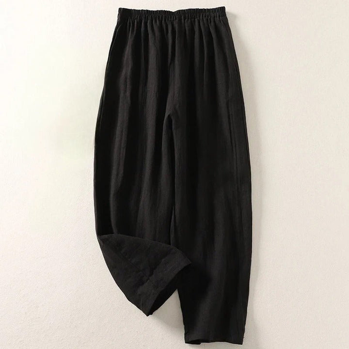 Comfortable women's high-waisted linen trousers, a modern and versatile bottom for various smart-casual looks.