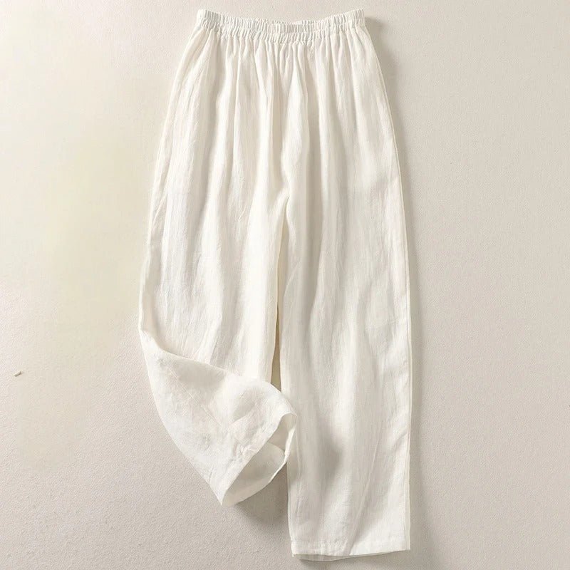 Modern woman's high-waisted relaxed linen trousers, offering supreme comfort & smart casual versatility.
