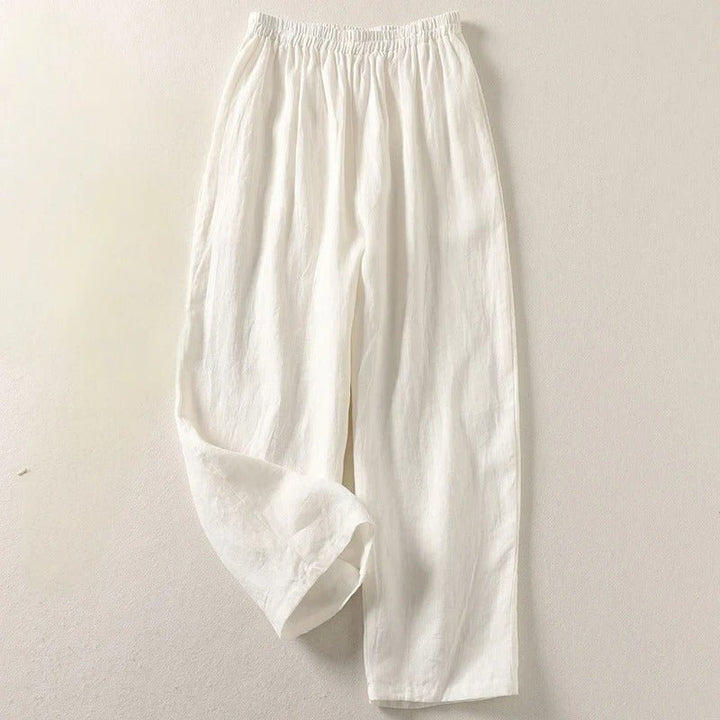 Modern woman's high-waisted relaxed linen trousers, offering supreme comfort & smart casual versatility.