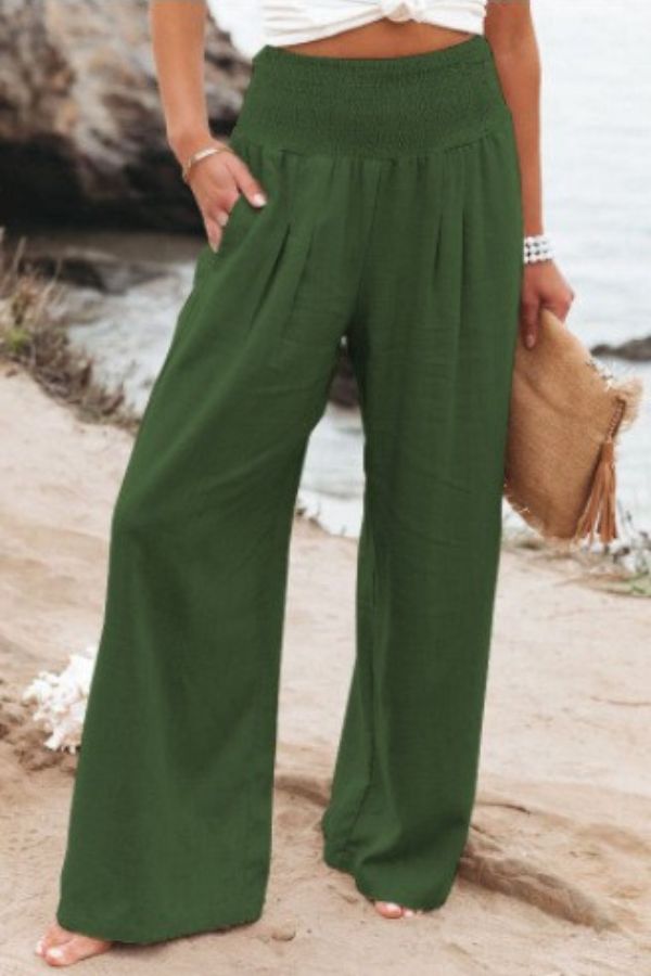 Versatile women's smocked high-waisted trousers. Wide-leg for both elegant and casual outfits.