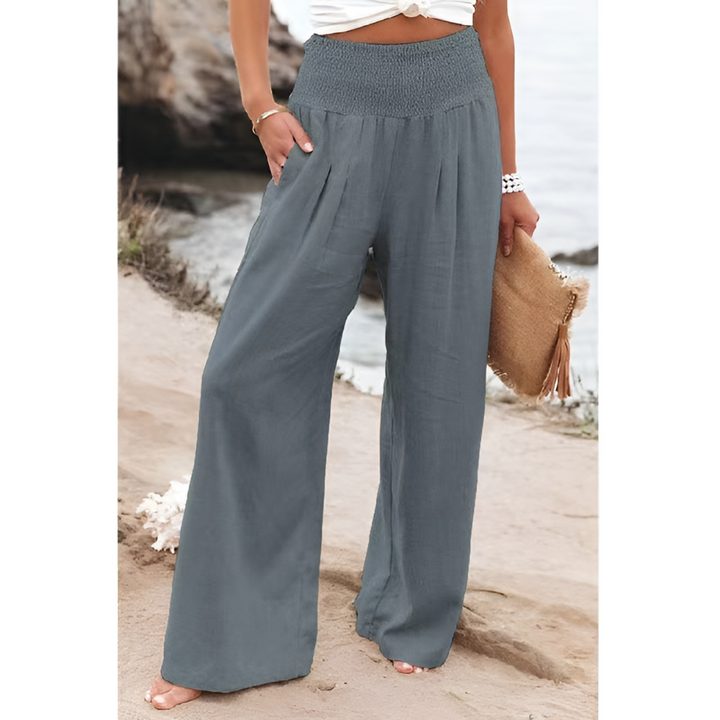 Plus size women's high-waisted stretch linen trousers, ensuring a comfortable & stylish fit for any occasion.