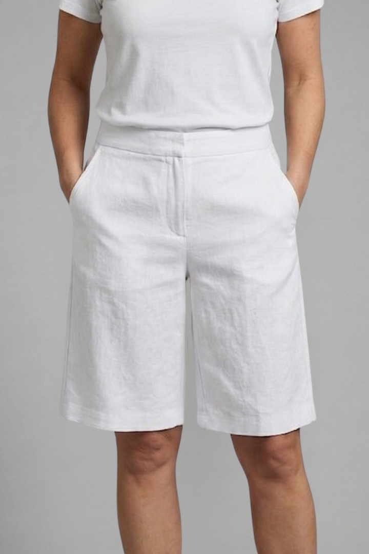 Elegant high-waisted tailored shorts for women, relaxed fit with pockets, perfect for summer fashion & casual wear.