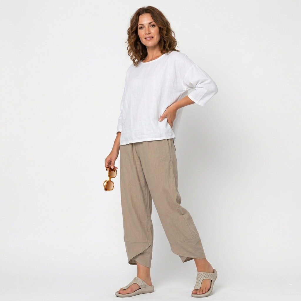 Detail of the elegant tulip hem on women's high-waisted trousers, highlighting unique design.