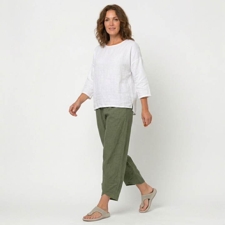 Fashionable high-waisted tulip hem trousers for women, blending comfort with contemporary style.