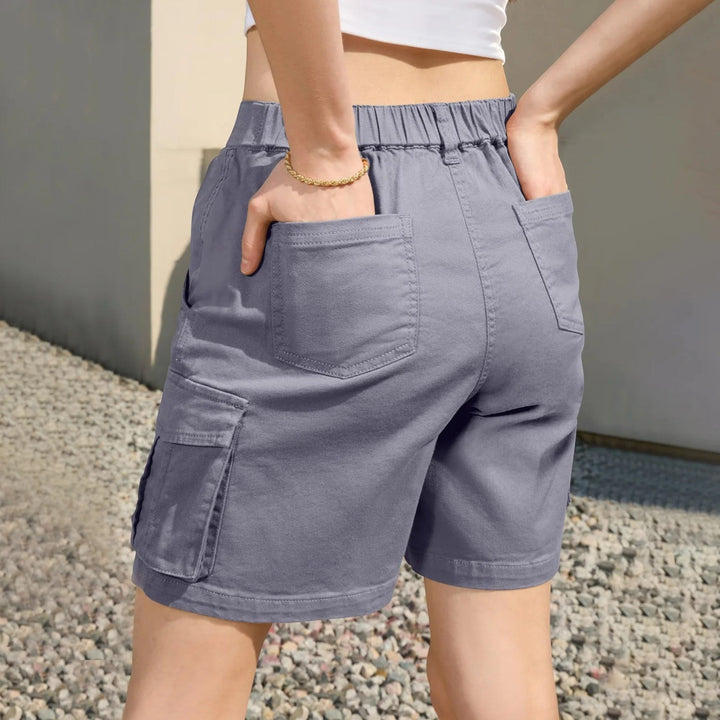 Close-up of women's multi-pocket cargo shorts, showing high-waisted design & comfortable utility style.