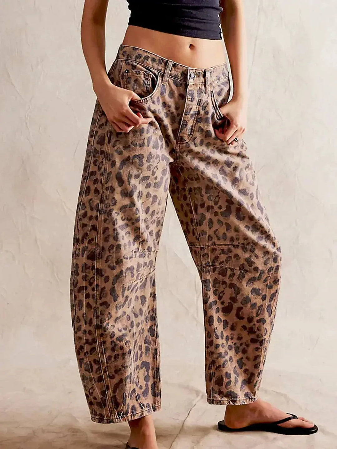Women's high waisted wide leg animal print jeans, trendy fashion style.