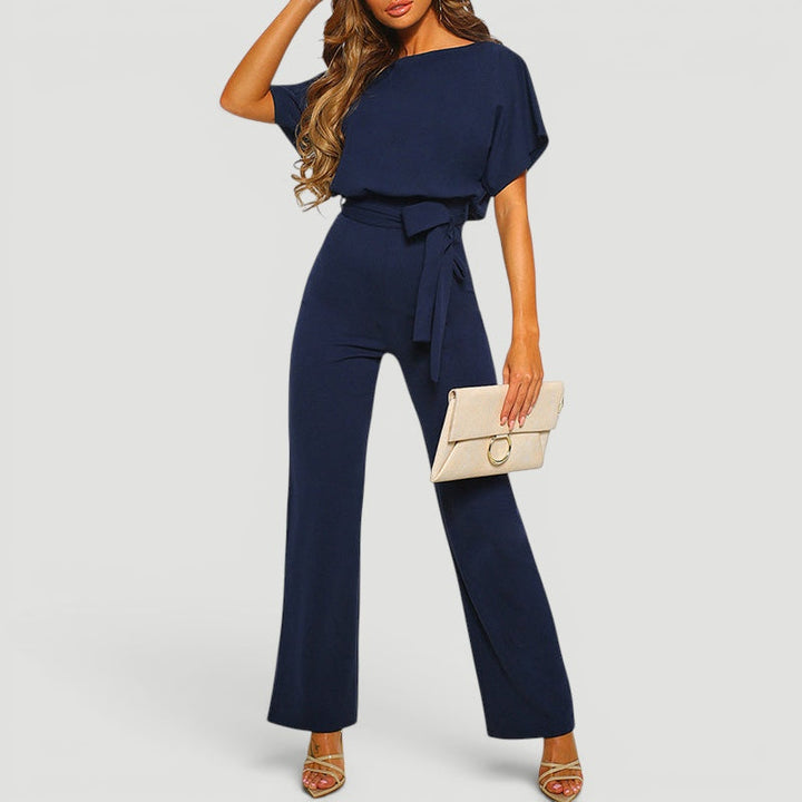 Detail of the stylish top and high waisted design of the women's wide leg jumpsuit, a versatile one piece.