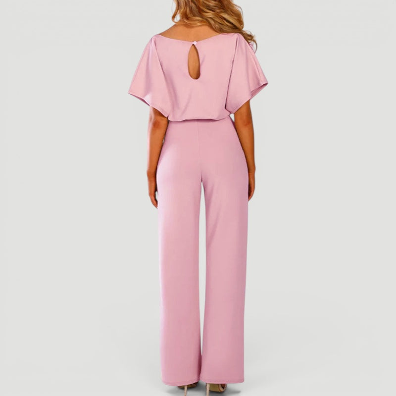 Back view of women's wide leg jumpsuit, showcasing comfortable fit & effortless style for various occasions.