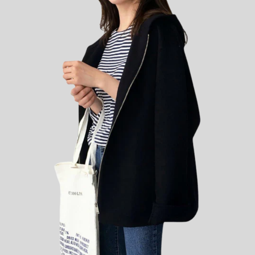 Women's hooded jacket, perfect for casual, travel, or outdoor wear. Features long sleeves, zipper front, & practical pockets.