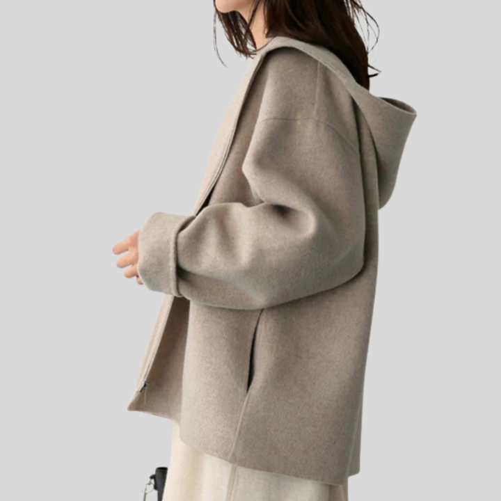 Stylish women's hooded jacket for daily wear. Comfortable outerwear with zipper, pockets, ideal for travel & casual style.