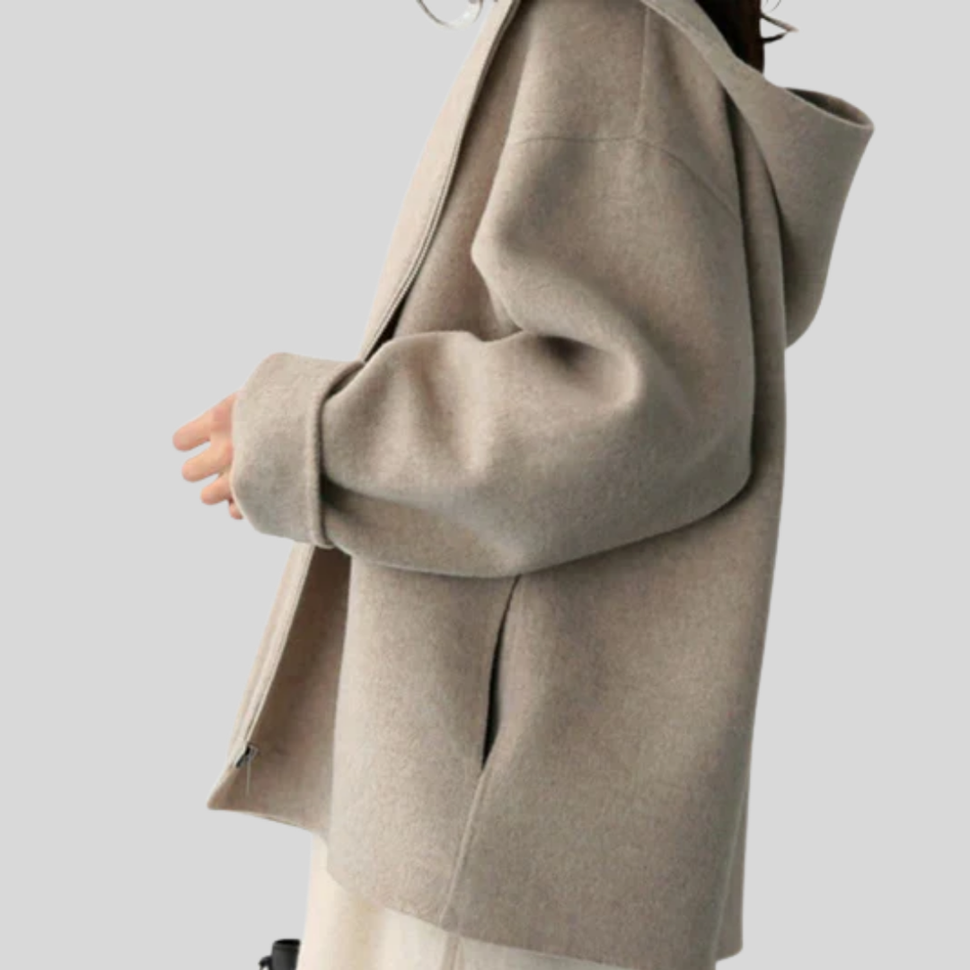 Functional women's hooded jacket. Versatile long sleeve outerwear with zipper & pockets, great for travel & outdoor activity.