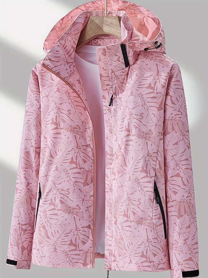 Stylish women's hooded rain jacket; wind & water resistant. Versatile outdoor jacket for everyday wear & adventures.