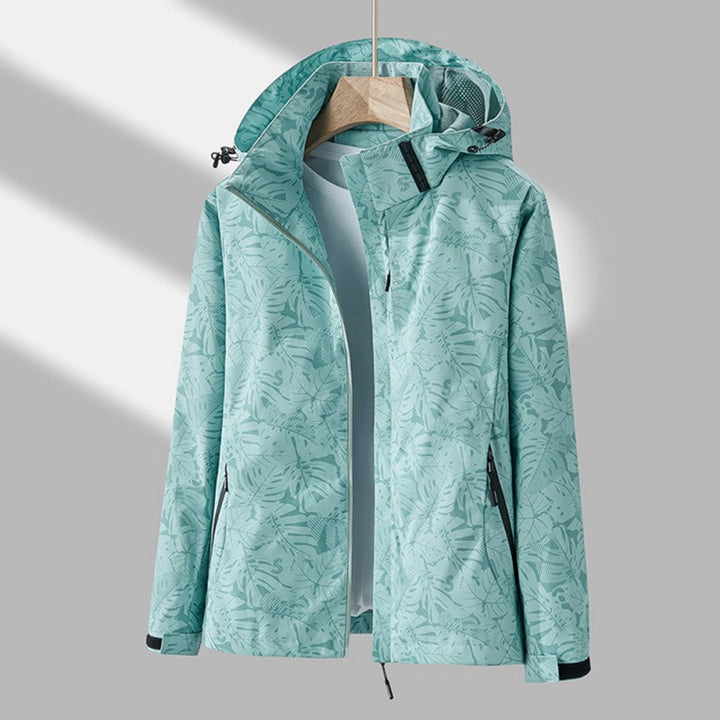 Versatile women's windproof & water-resistant hooded jacket. Essential lightweight outerwear for outdoor adventures.