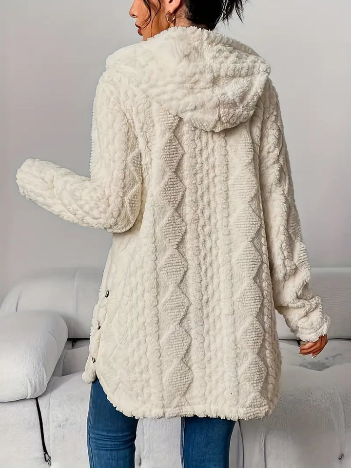 Chic women's hooded longline cardigan, modern textured knit, perfect for an oversized look.