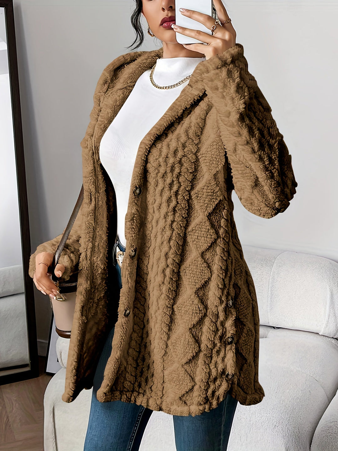 Cozy knit women's longline cardigan with textured weave, hooded for warmth & style.