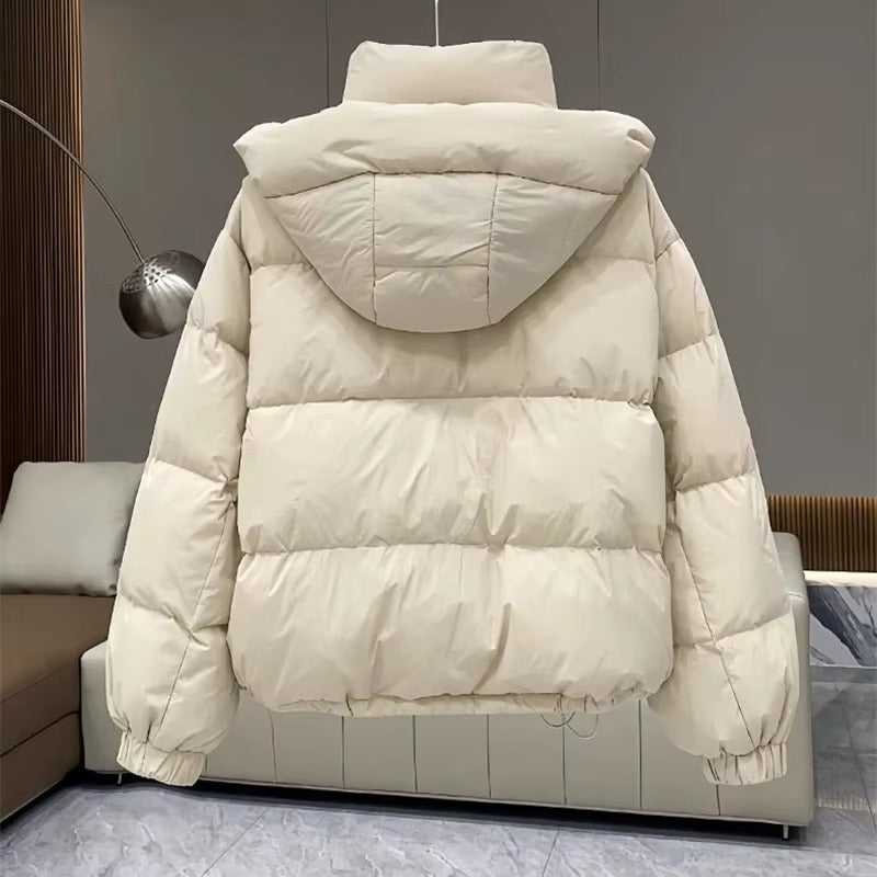 Women's cozy hooded puffer jacket, high neck, excellent for staying warm during winter.