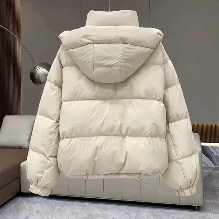 Women's cozy hooded puffer jacket, high neck, excellent for staying warm during winter.