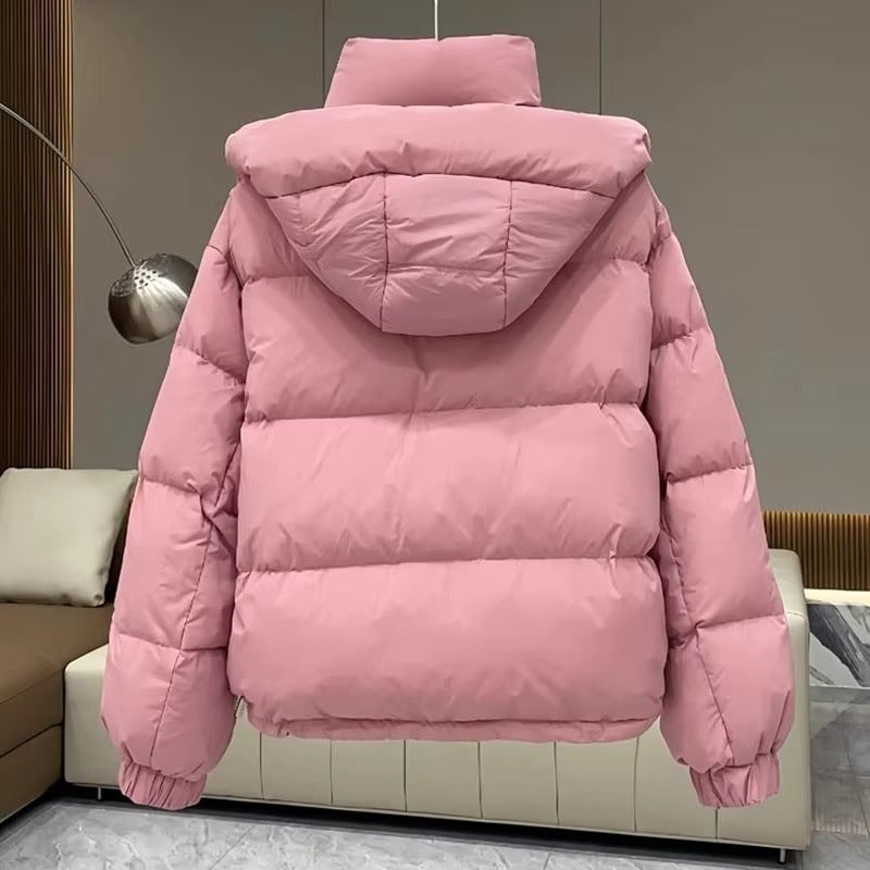 Women's hooded puffer jacket, featuring a warm high neck, perfect for winter adventures.