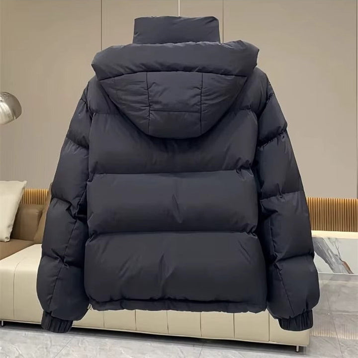 Warm women's hooded puffer jacket with a high neck, perfect winter coat for cold.