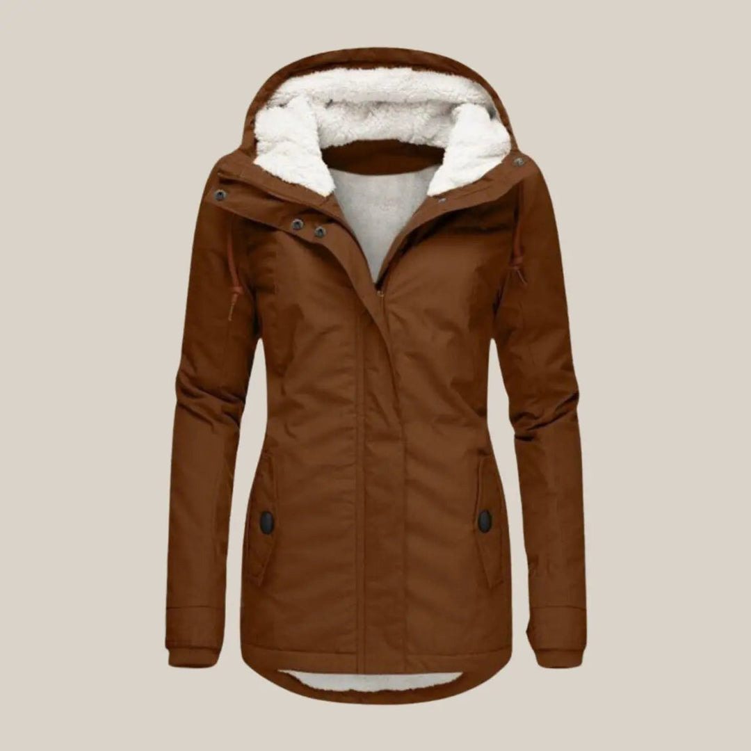 Fashionable women's hooded quilted winter jacket. Warm and practical for chilly autumn days.