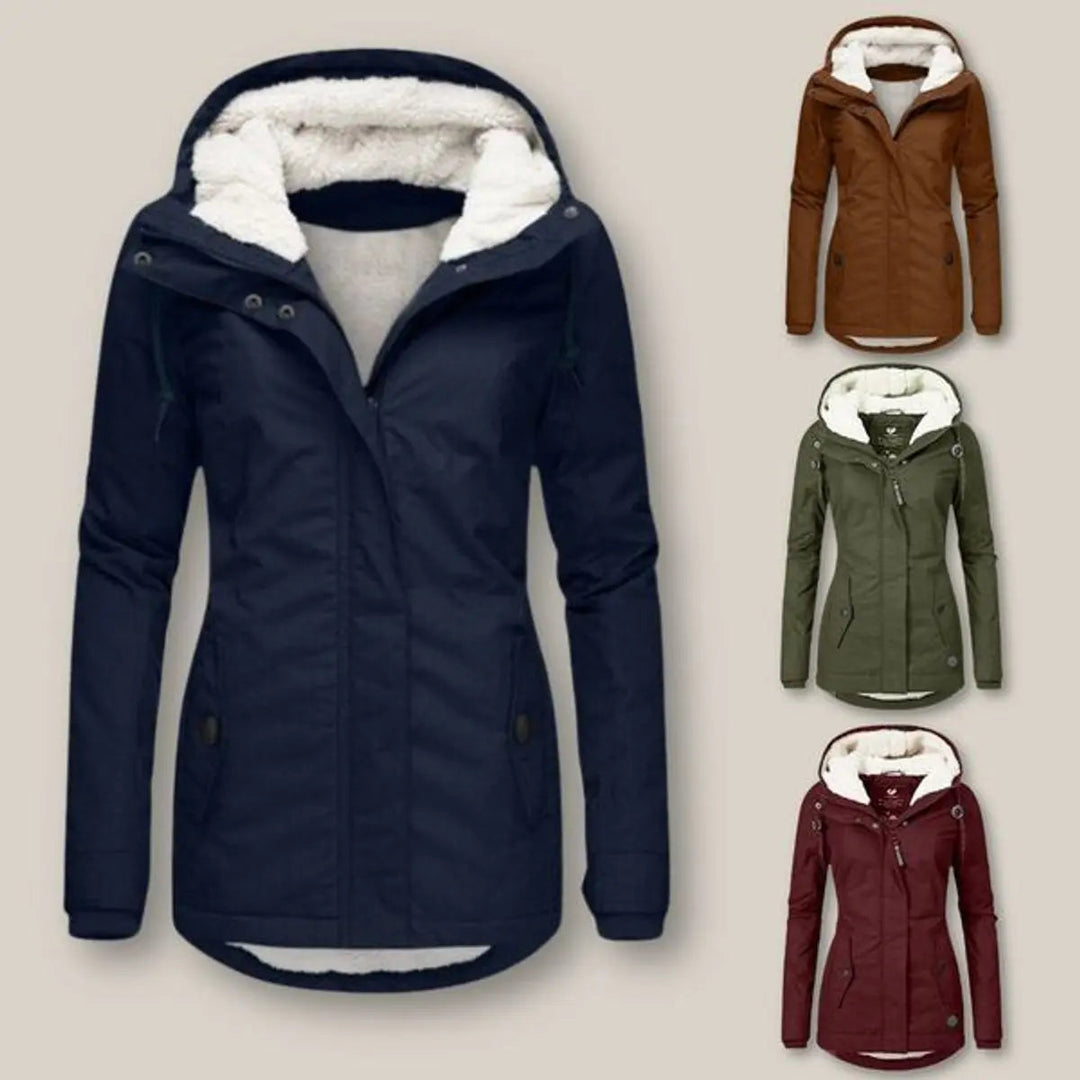 Cozy women's quilted winter jacket, featuring a warm fleece lining and protective hood.