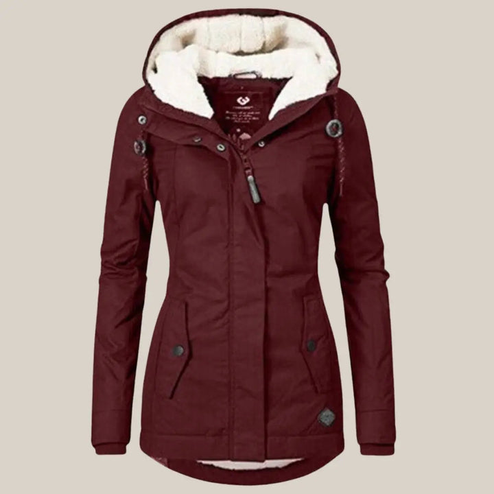Versatile women's hooded quilted jacket. Stylish outerwear for cold autumn & winter seasons.