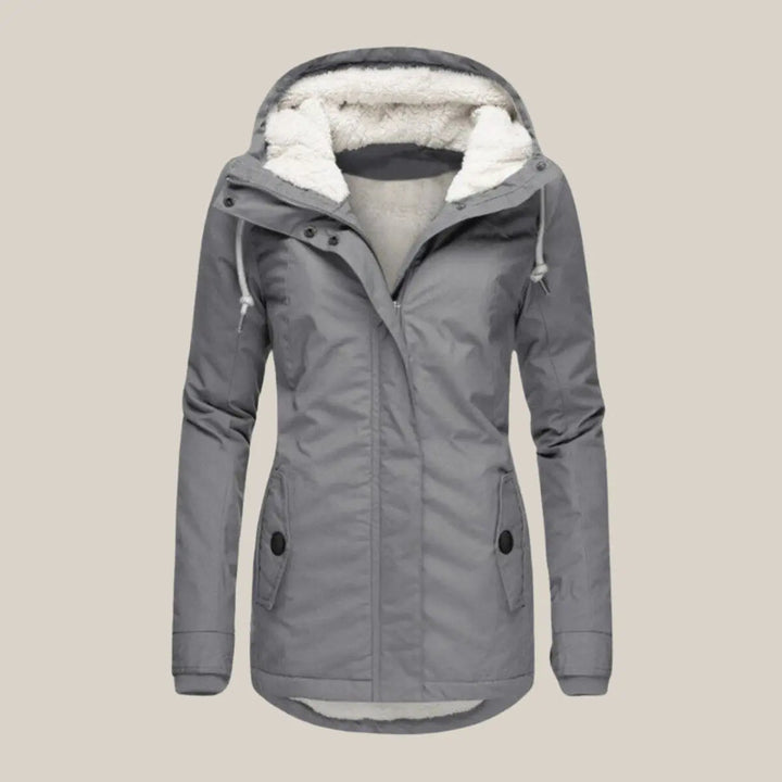 Casual women's hooded quilted jacket. Fleece-lined for comfort in urban cold weather.