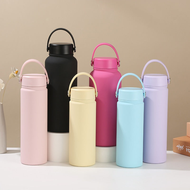 Women's insulated stainless steel water bottle with ergonomic handle for daily hydration.