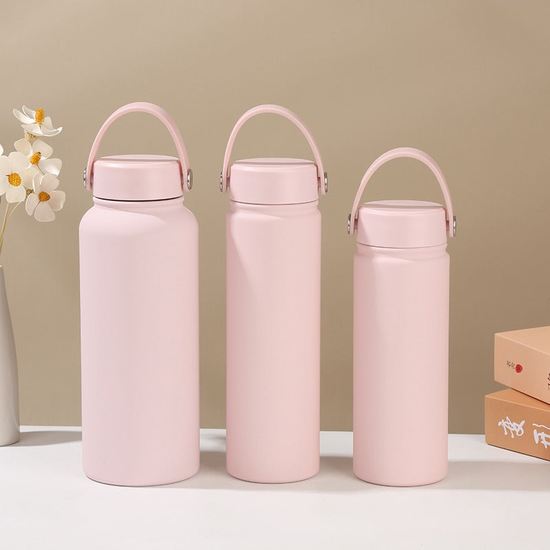 Durable stainless steel women's insulated water bottle, ergonomic handle, great for everyday hydration needs.