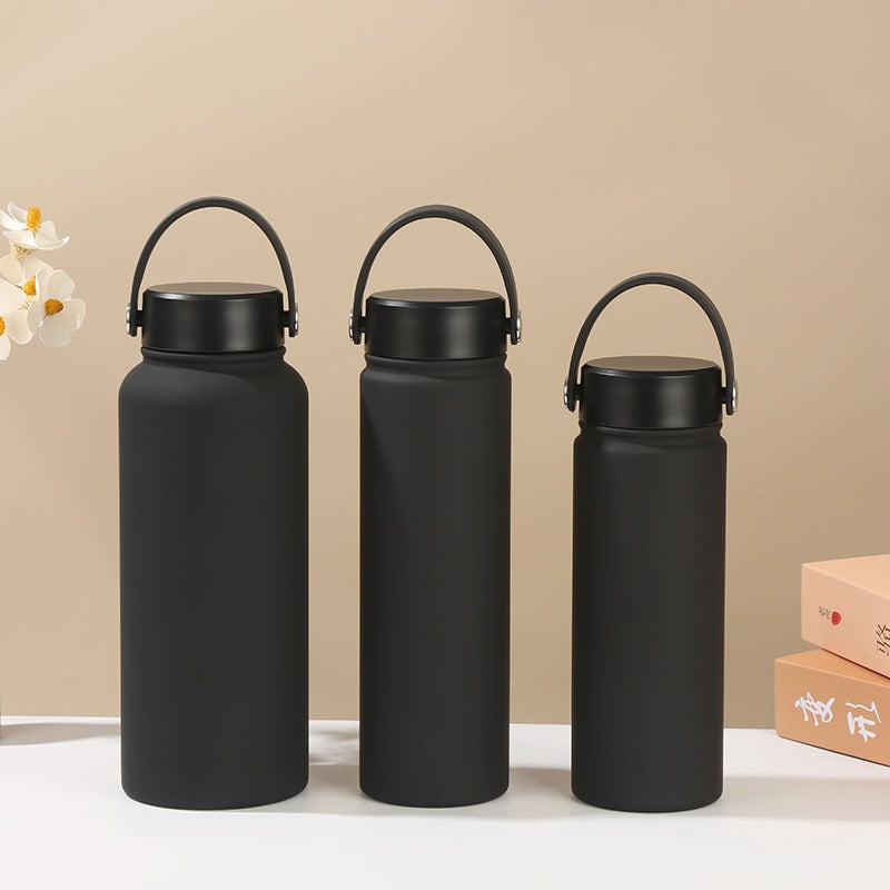 Ergonomic handle women's insulated stainless steel water bottle, leak-proof, for gym and everyday use.