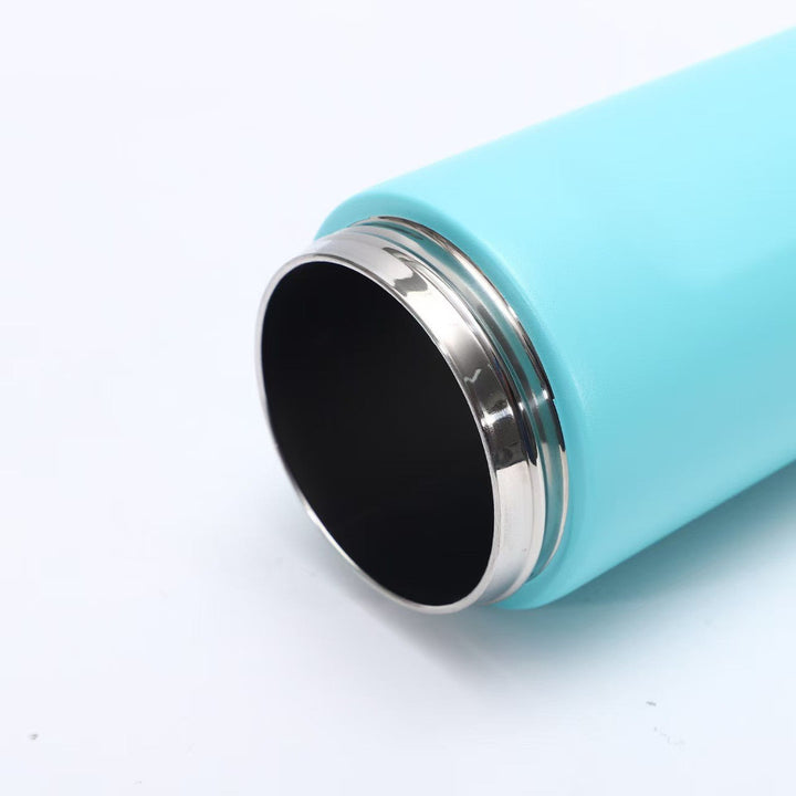 Portable women's water bottle, keeps beverages hot or cold. Reusable hydration for sport & travel.