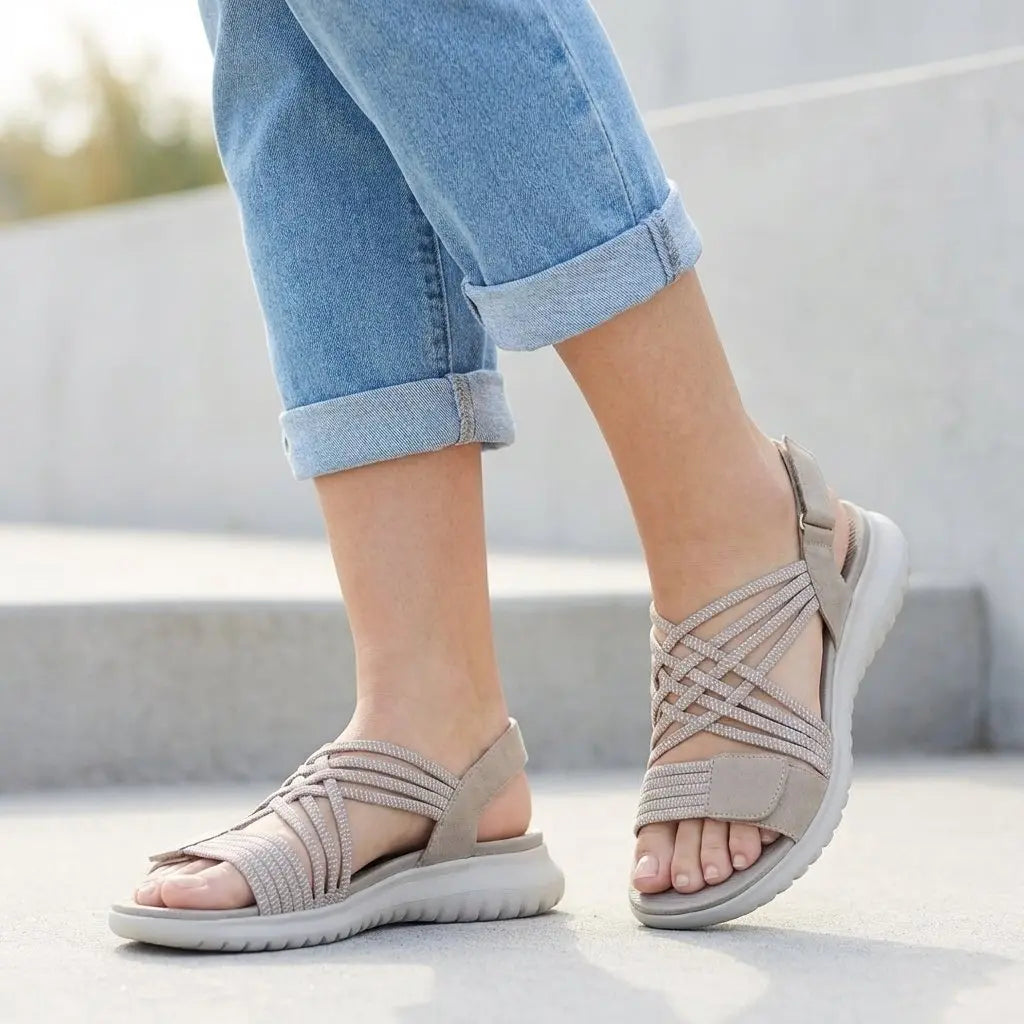 Close-up: Women's Isla orthopedic flat sandals, highlighting criss-cross straps, adjustable buckles & comfy footbed.