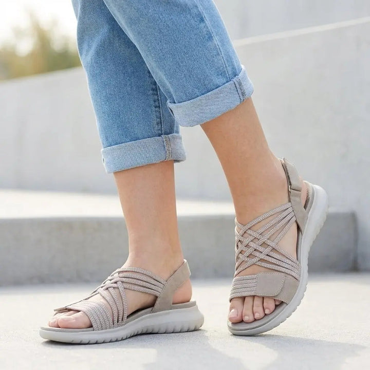 Close-up: Women's Isla orthopedic flat sandals, highlighting criss-cross straps, adjustable buckles & comfy footbed.