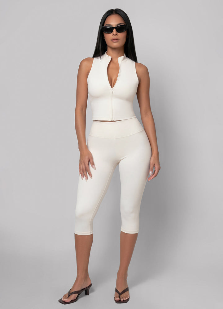 High-waisted ivory capri leggings for women, versatile athleisure wear for casual or workout styles.